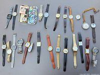 Overview of all wristwatches, pocket watch and tins laid out