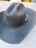 Full view of black felt cowboy hat showing crown and brim