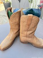 Side view pair of tan Tecovas cowboy boots