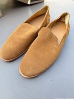 Top view of both honey tan suede loafers
