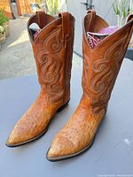 Full view of both boots standing upright