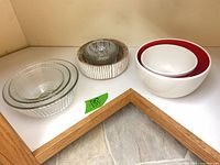 Overview of all bowls and juicer nested on shelf