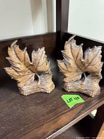 Front view showing leaf design and finish of both bookends