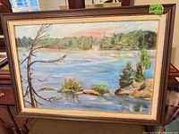 Front view of framed landscape painting