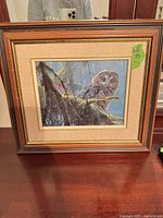 Full view of framed owl print on tabletop