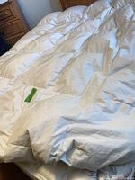 Comforter laid on bed showing overall appearance and baffle boxes