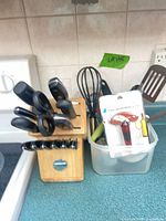 Knife block and utensil tub on countertop