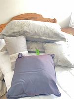 Group view of all five pillows on bed