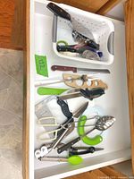 Drawer overview showing majority of utensils spread out