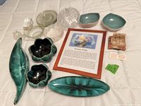 All items laid out showing variety of ceramics, glassware, print, plaque