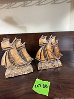 Front view of both sailing ship bookends showing design and finish