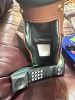 Front view of golf bag telephone showing keypad and faux leather exterior