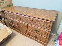 Front view of long dresser showing drawer layout and hardware