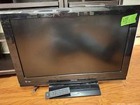 Front view of Toshiba 32-inch TV on stand