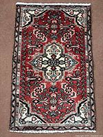 Full view of Hamedan rug showing entire design and fringe