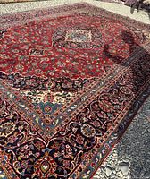 Full view of Persian Kashan rug laid flat