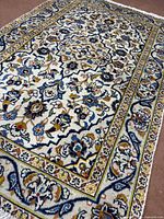 Angled close-up showing border and field colors and pile