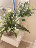 Both artificial plants displayed on countertop