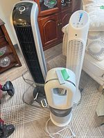Three fans side by side showing overall condition and size comparison