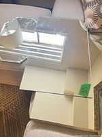 Rectangular mirror and hexagonal mirror on sofa