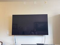 Front view of Sony 55-inch TV mounted on wall