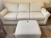 Front view of Stylus 3-seat sofa and ottoman