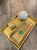 All five items grouped: large tray, smaller tray, wire basket, square and round trinket boxes