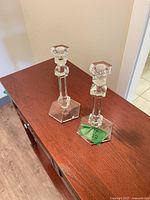 Pair of crystal candlesticks on table