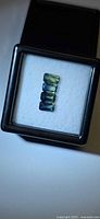 four rectangular sapphires in display box