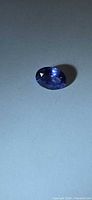 Top view of oval violet-blue tanzanite gemstone