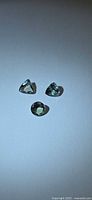 Three loose mint green tanzanite stones displayed on white background