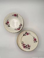 Top view of two Ridgway 1792 pieces showing rose pattern and gilt edge