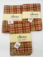 Front view of three Alkaso napkin packs