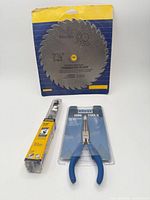 Packaged 7-1/4" blade, Irwin auger bit, Rogue pliers
