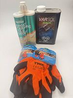 Full lot showing grout cartridge, Varsol can, two pairs gloves