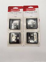 Front view of four sealed Rubbermaid 4-Edge Scraper Blade packs