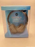 Front of sealed retail box displaying headphones and branding