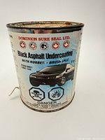 Front view of the Dominion Sure Seal black asphalt undercoating can