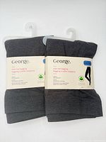 Front view showing two packs of George leggings with labels