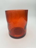 Front view of amber bubbled glass hurricane candle holder