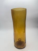 Full view of amber seeded glass hurricane candle holder