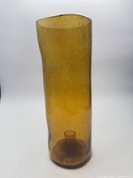 Full view of amber seeded glass hurricane candle holder