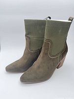 Full view of both olive Kinley boots side by side
