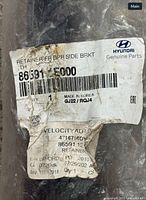 Hyundai label showing part number 86591-1E000 and description