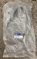 Sealed plastic bag with Hyundai label containing hinge assembly