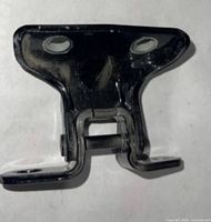 Front view showing entire hinge, mounting holes visible