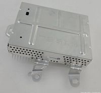 top view of Tesla amplifier showing TESLA lettering and mounting bracket