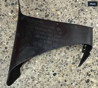 Overall view of black bumper trim showing shape