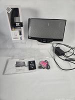 Full lot showing Bose SoundDock, remote, manual, cables, POP Phone box