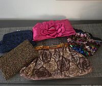 All five handbags laid out for size and style overview